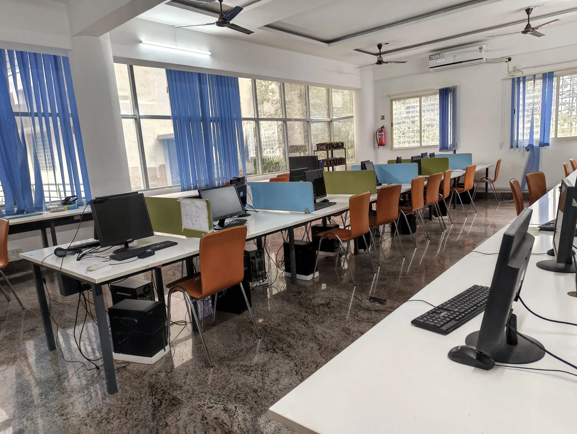 Computer lab with rows of desktop computers