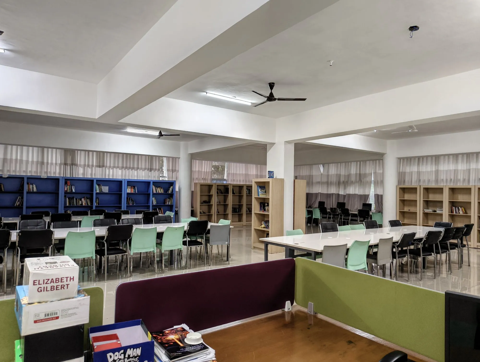 Library with reading tables and bookshelves