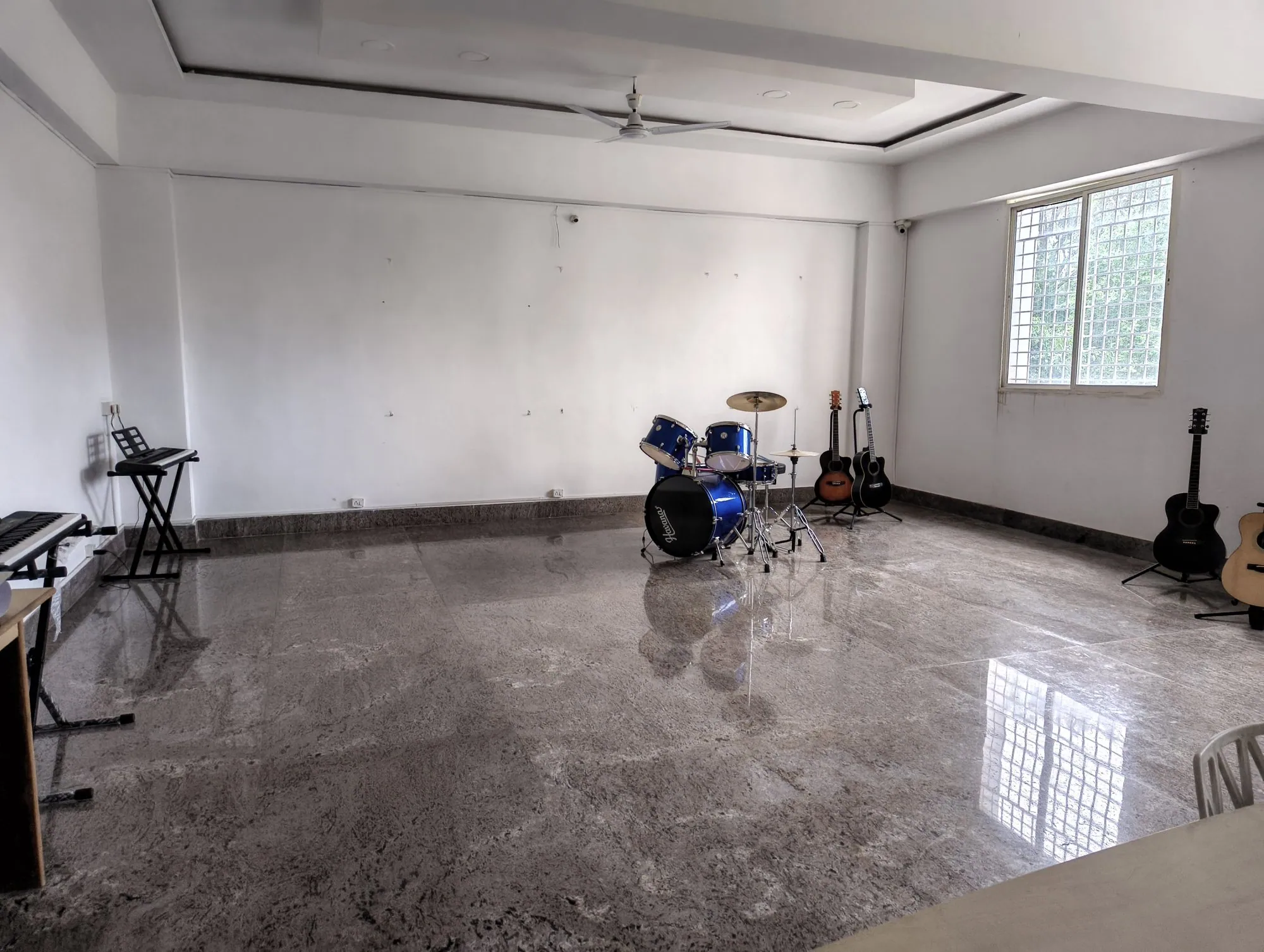 Music room with drum kit, keyboard and guitars